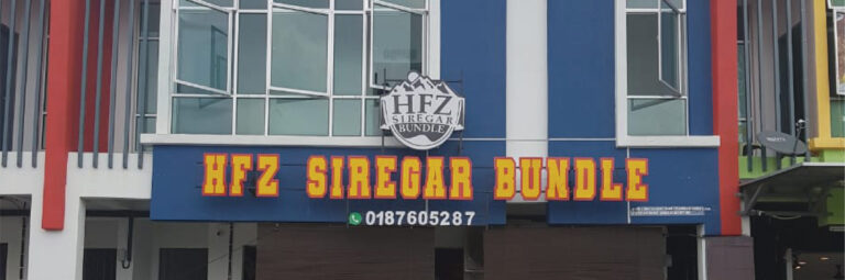 Butik Fazuhaa shop sign with embossed lettering and clean layout