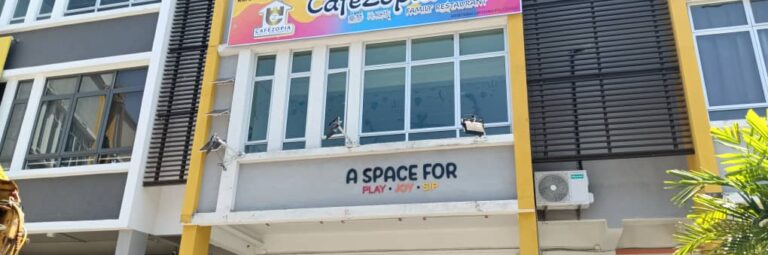 Playful and colourful café signage with embossed lettering