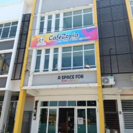 Playful and colourful café signage with embossed lettering